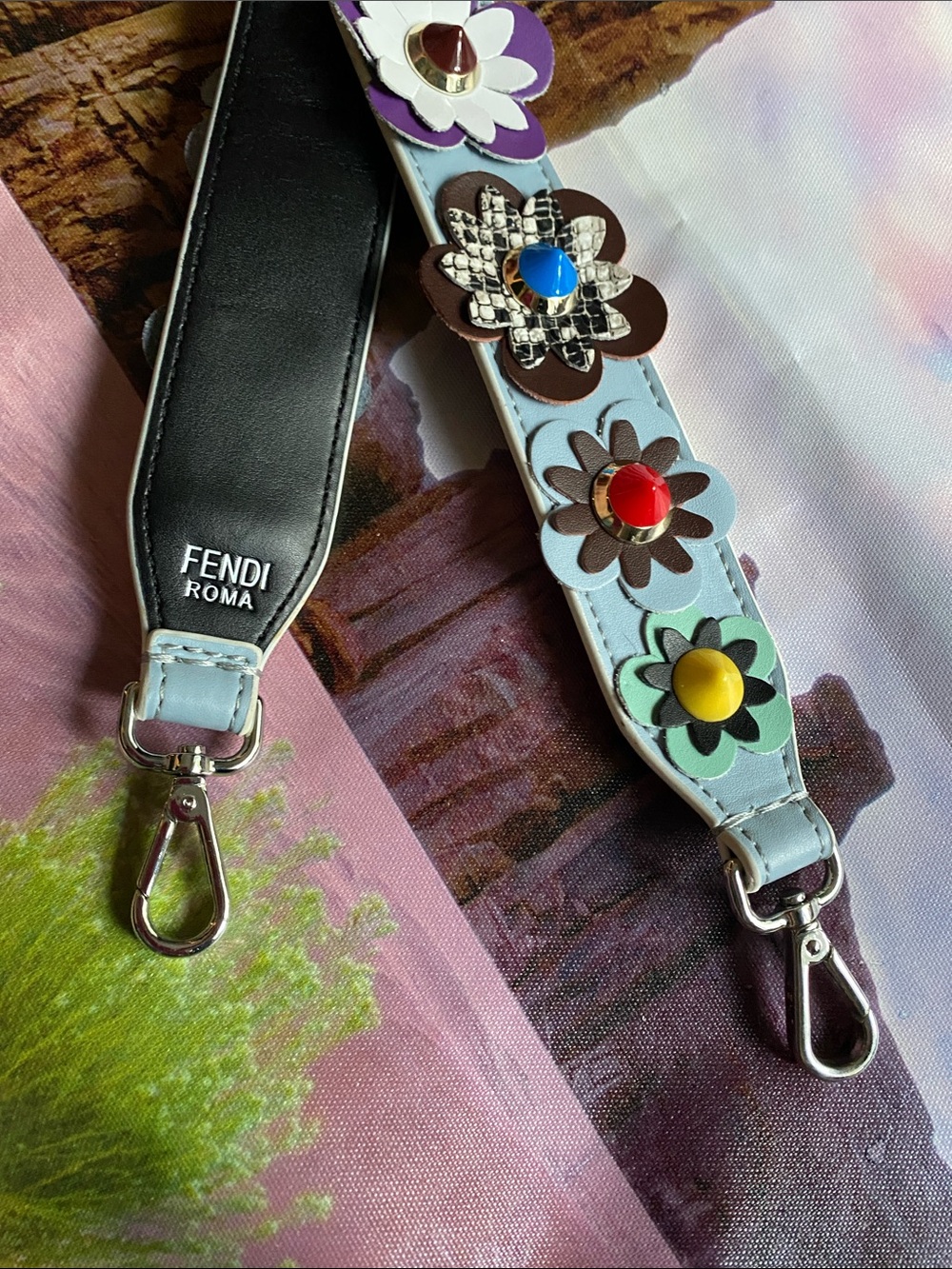 Fendi Light Blue Leather Floral-Embellished Strap with Multicolor Studs.